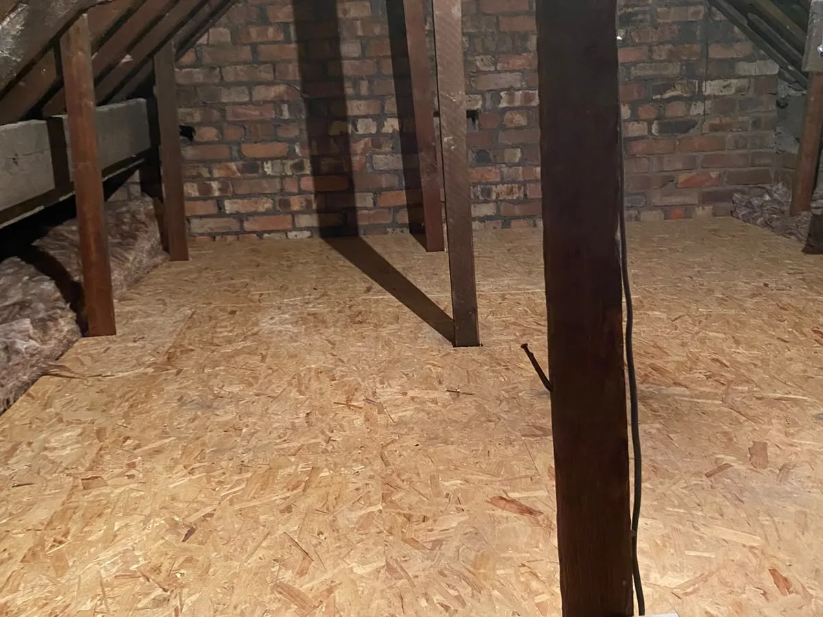 Boarded loft deck running up to the gable wall