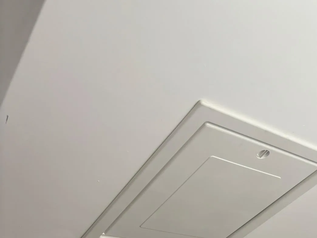 New white loft hatch, closed and flush with the ceiling