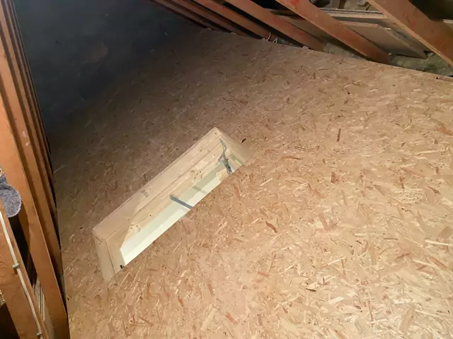 Boarded deck around a timber-framed hatch opening