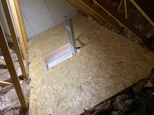 Boarded deck over insulation with the ladder hatch cut in