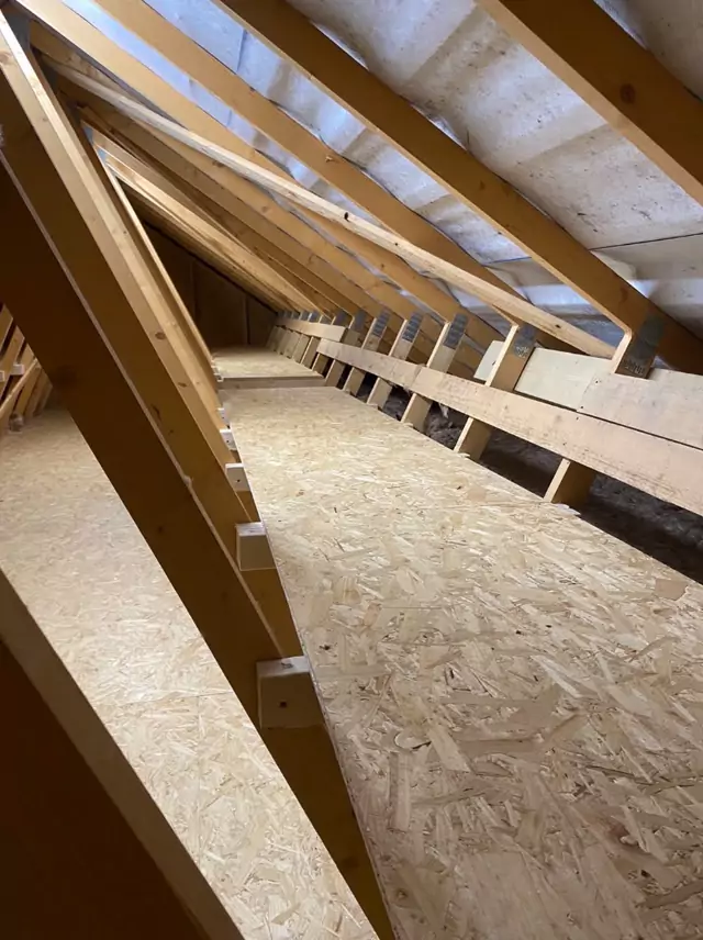 Boarded walkway running the length of a trussed loft