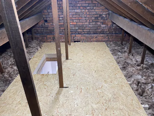 Boarded section round the hatch between timber props, insulation either side