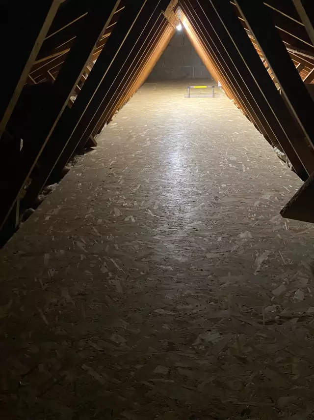 Fully boarded trussed loft, looking down the ridge