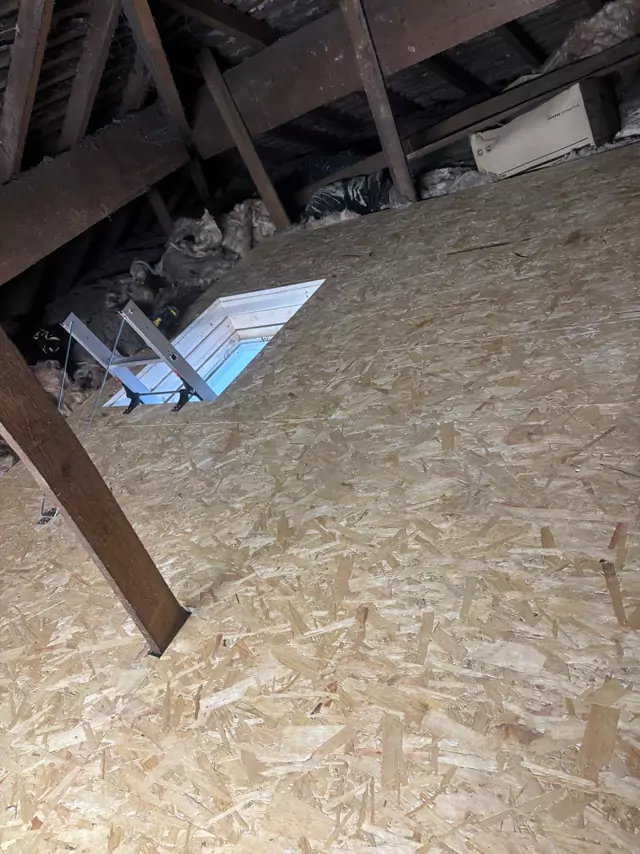 Boarding round a hatch with the loft ladder unfolding through it