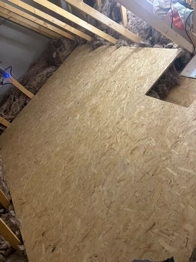 Boarded deck notched round the trusses