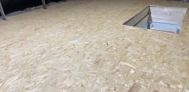 Boarding laid across a whole loft with the hatch cut in