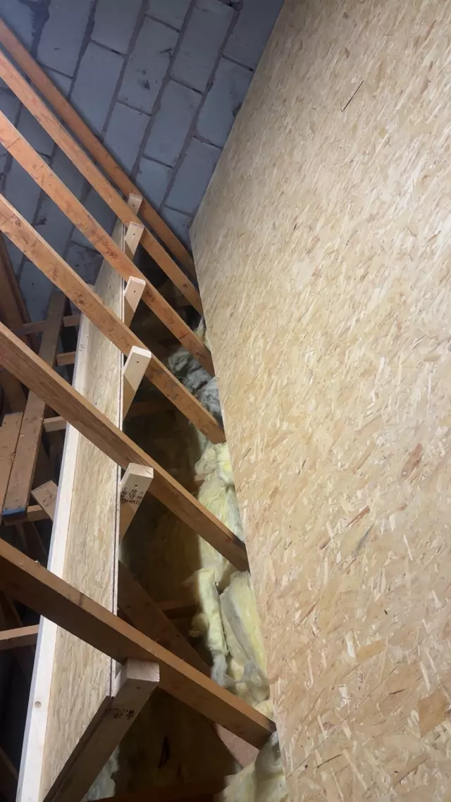 Boarding laid along the length of a loft beside the trusses