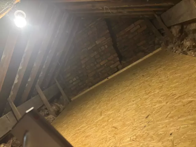 Boarded floor under an older timber roof