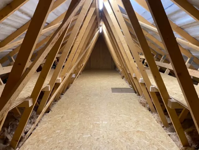 Boarded trussed loft looking down the ridge
