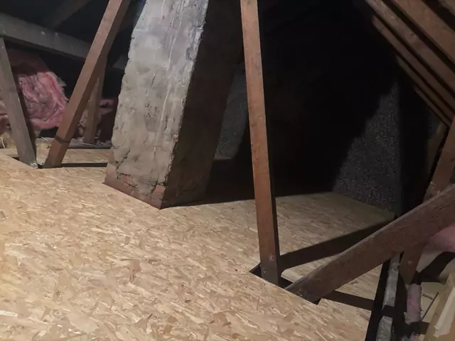 Boarding finished round the chimney stack and props